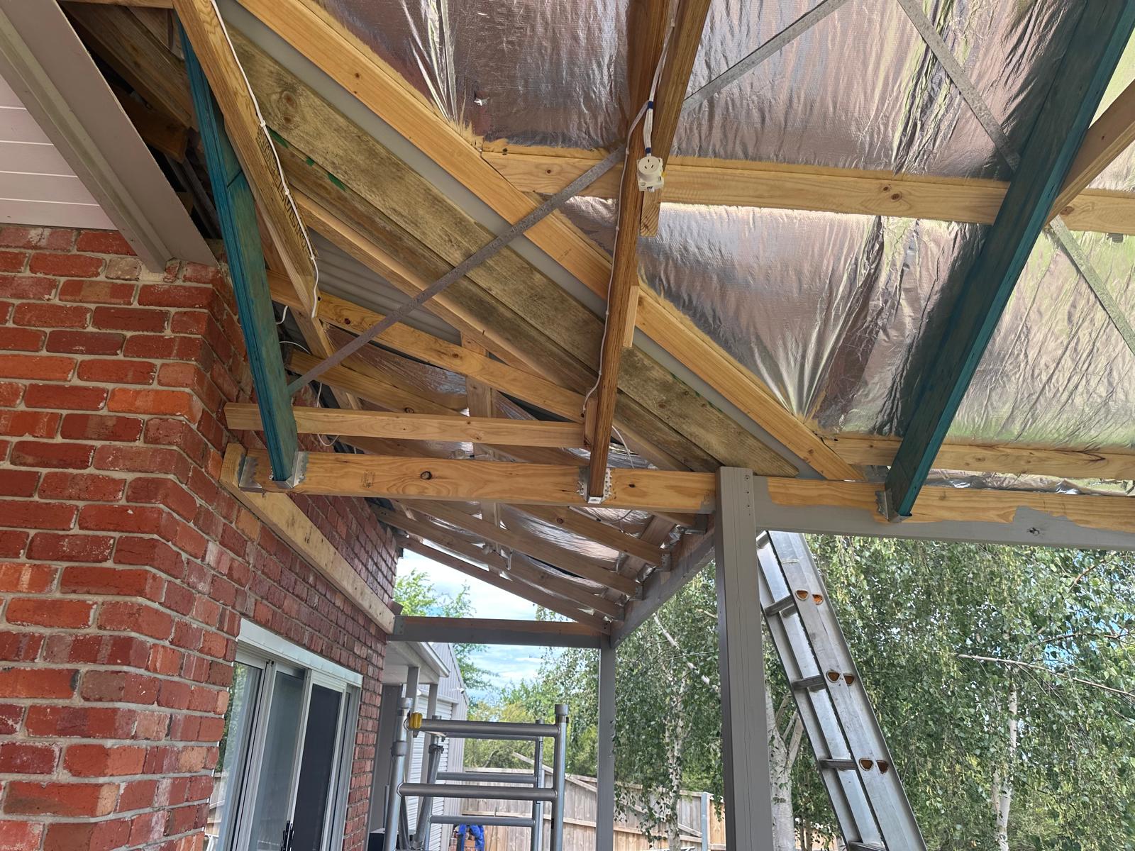 Pitched roof timber truss construction with foil